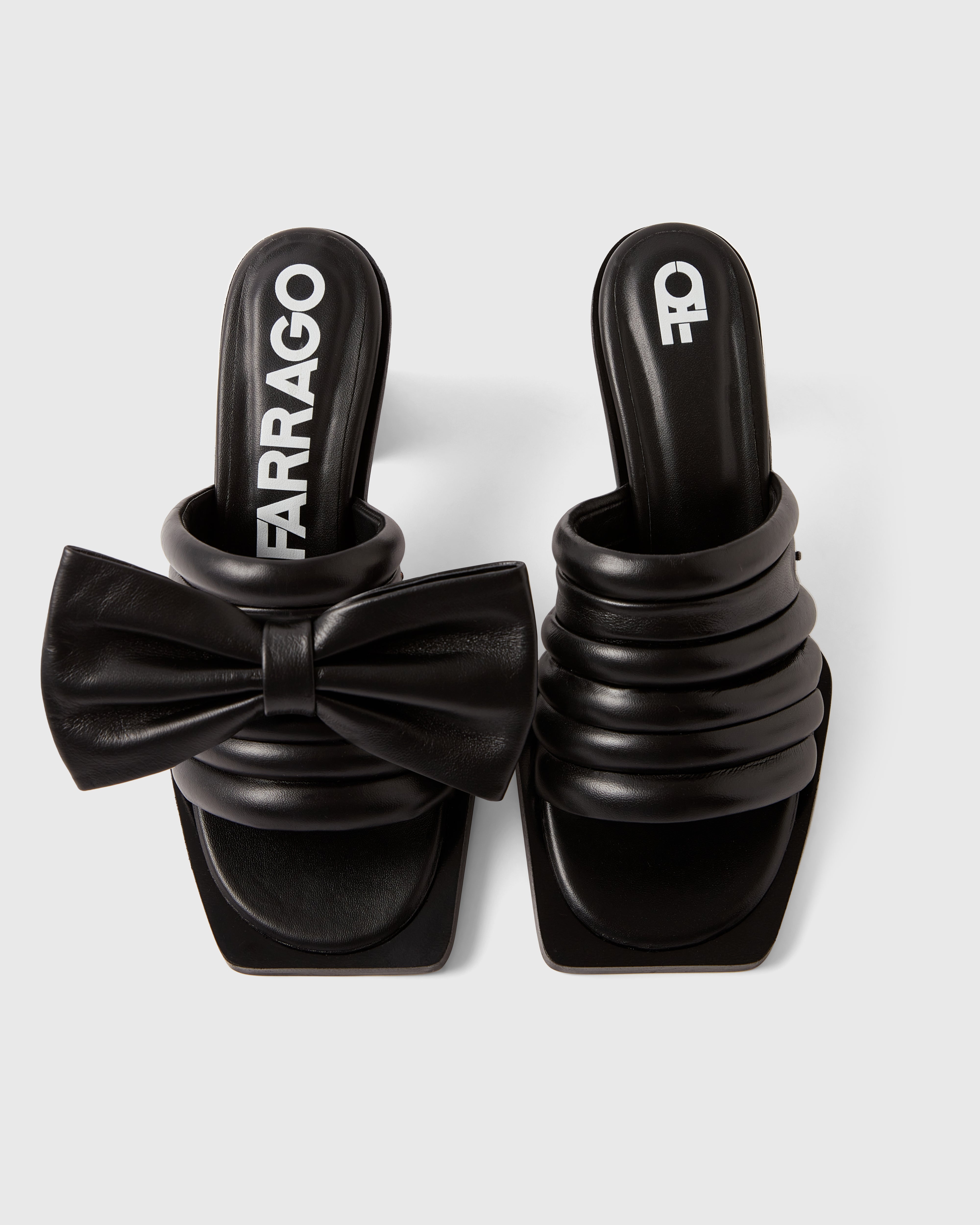 Farrago Charter sustainable designer leather heeled mules in jet black with jet black leather bow accessories.