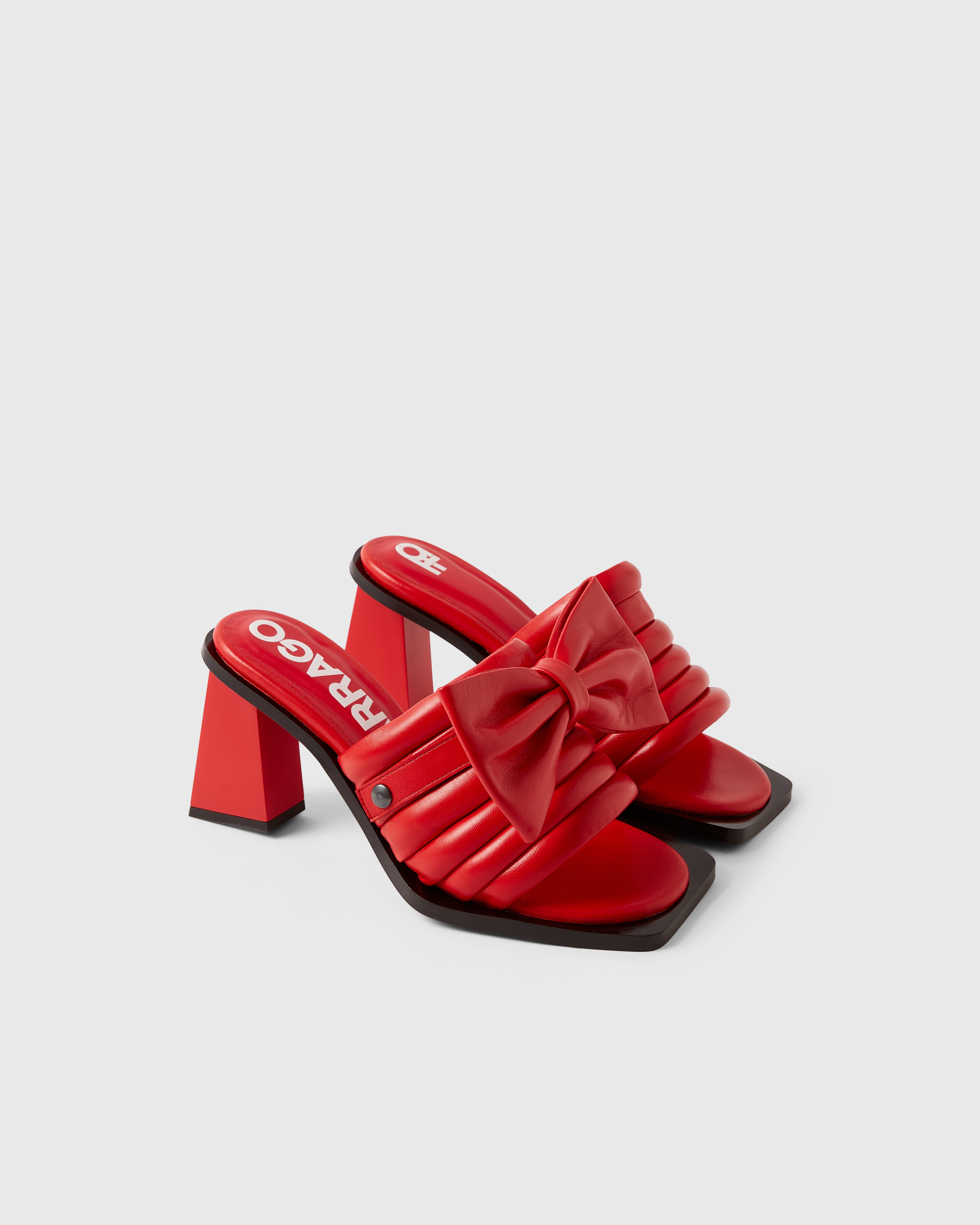 Farrago Charter sustainable designer leather heeled mules in ravish red with ravish red leather bow accessories.