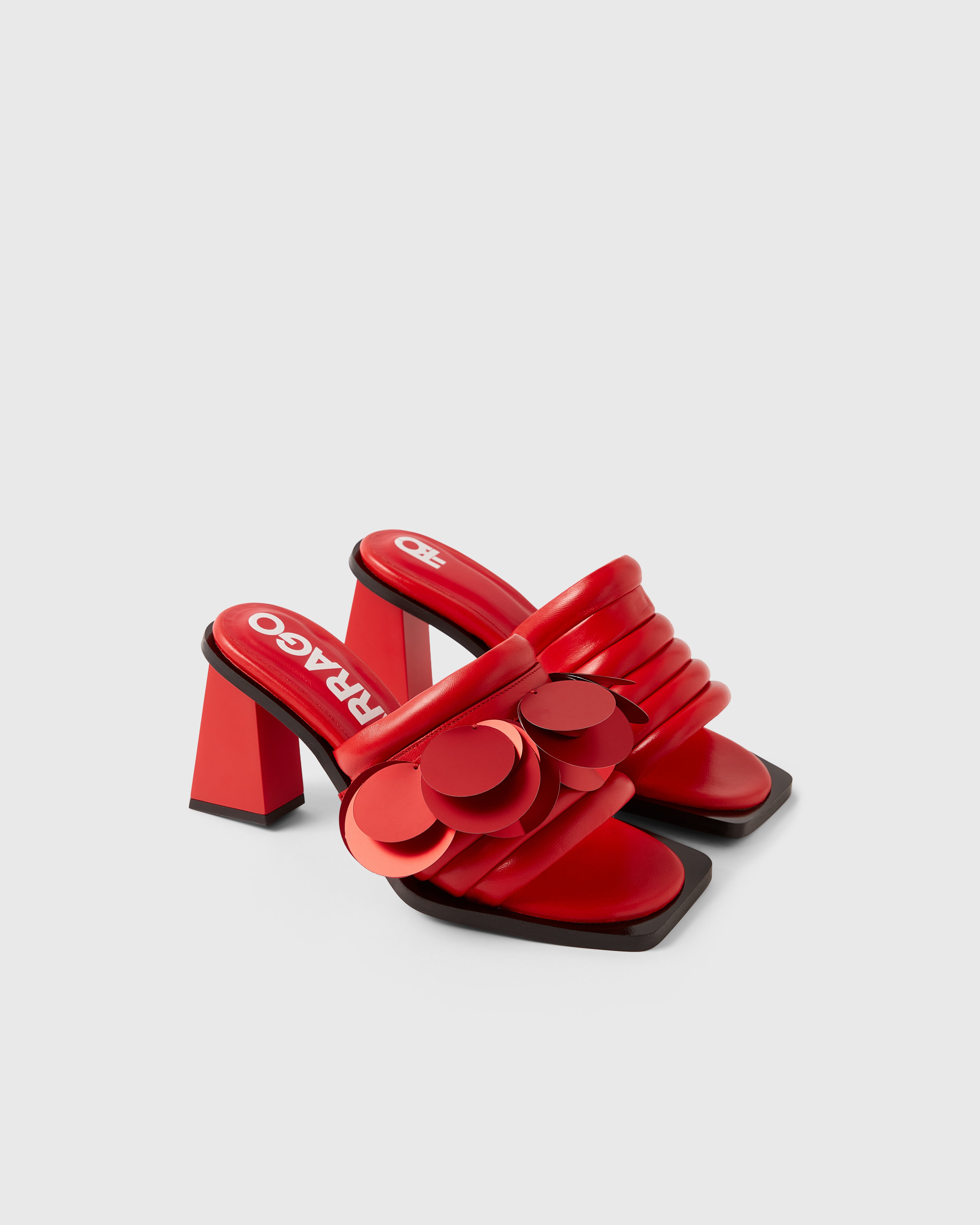 Farrago Charter sustainable designer leather heeled mules in ravish red with ravish red oversized sequin accessories.