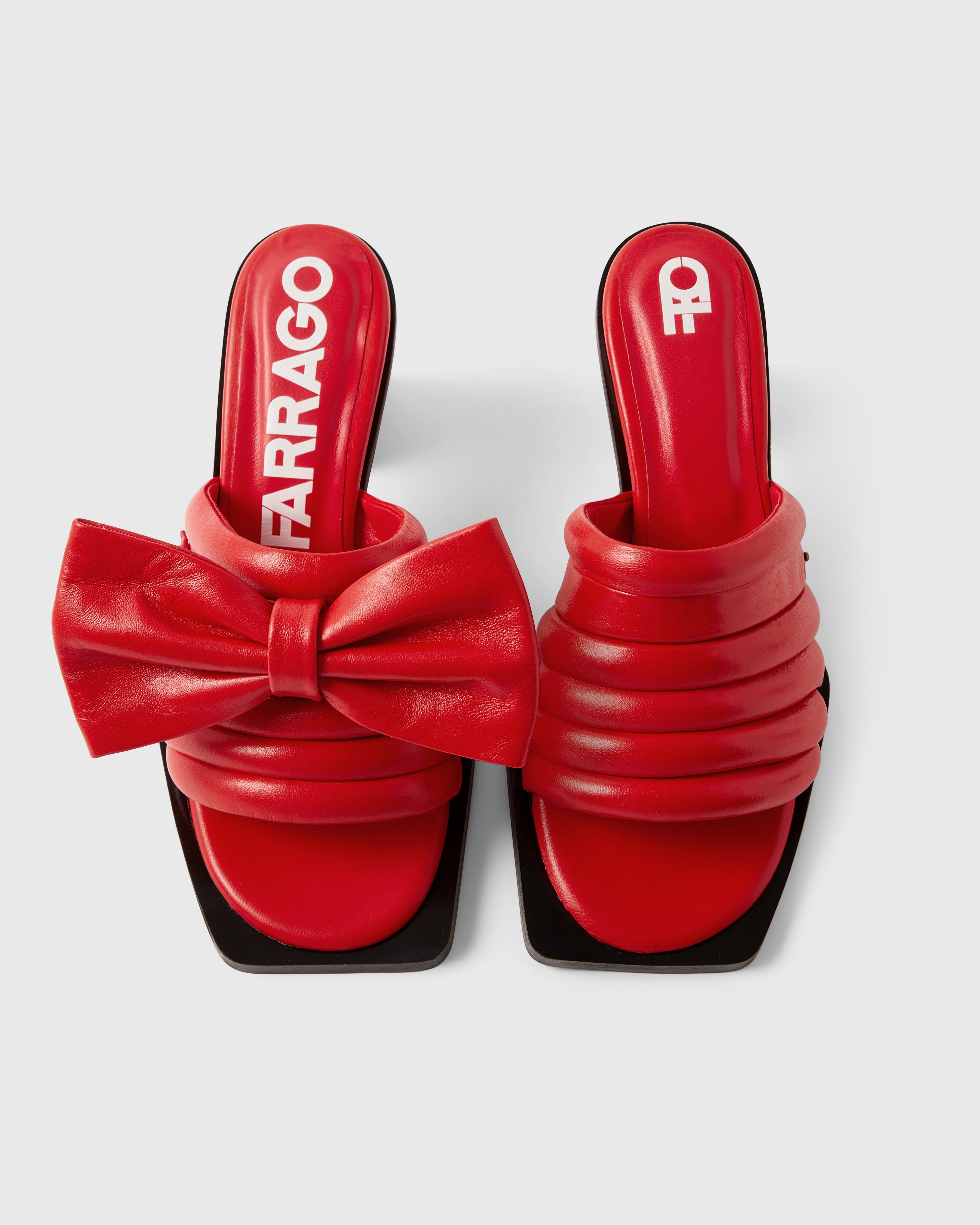 Farrago Charter sustainable designer leather heeled mules in ravish red with ravish red leather bow accessories.