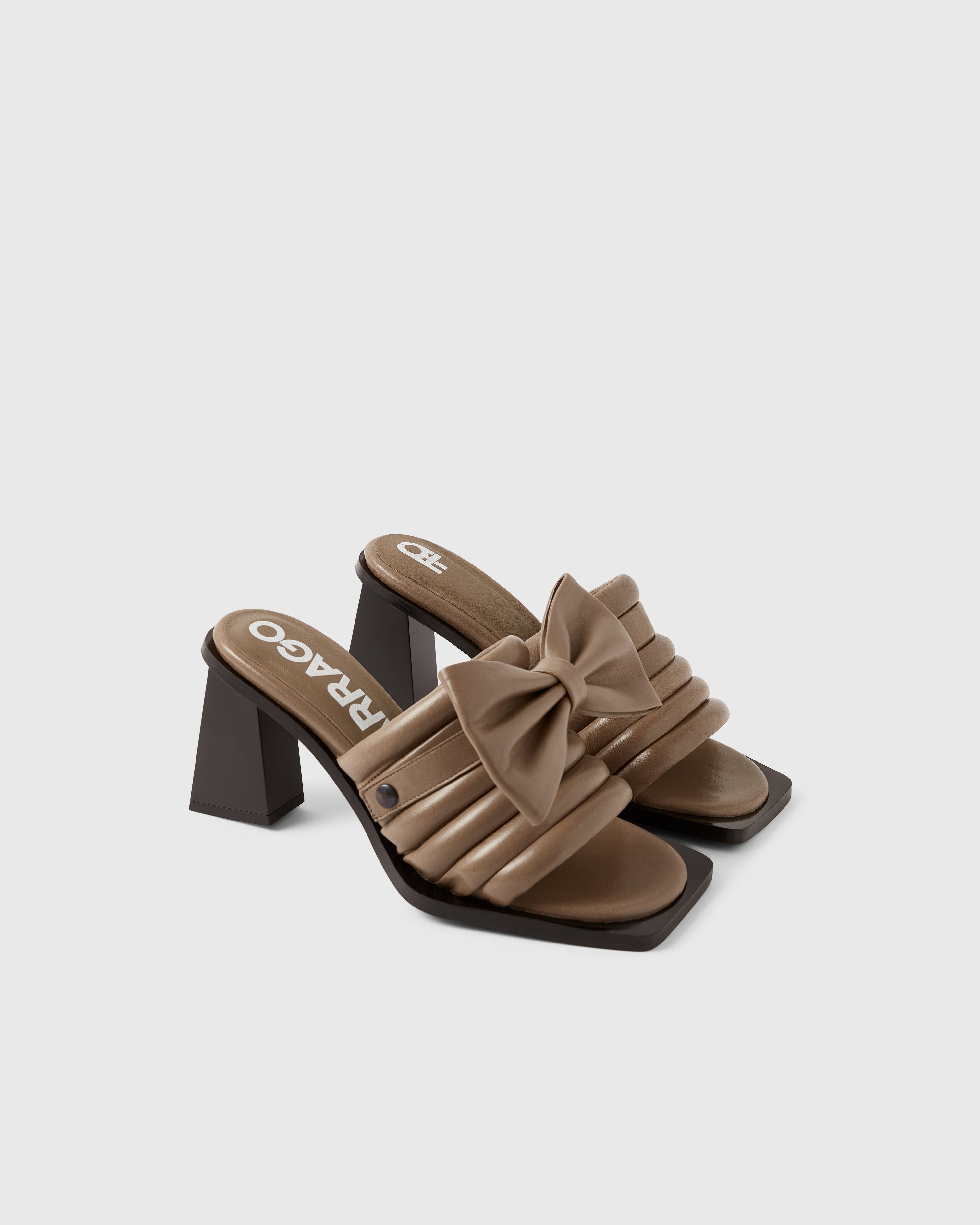 Farrago Charter sustainable designer leather heeled mules in truffle taupe with truffle taupe leather bow accessories.