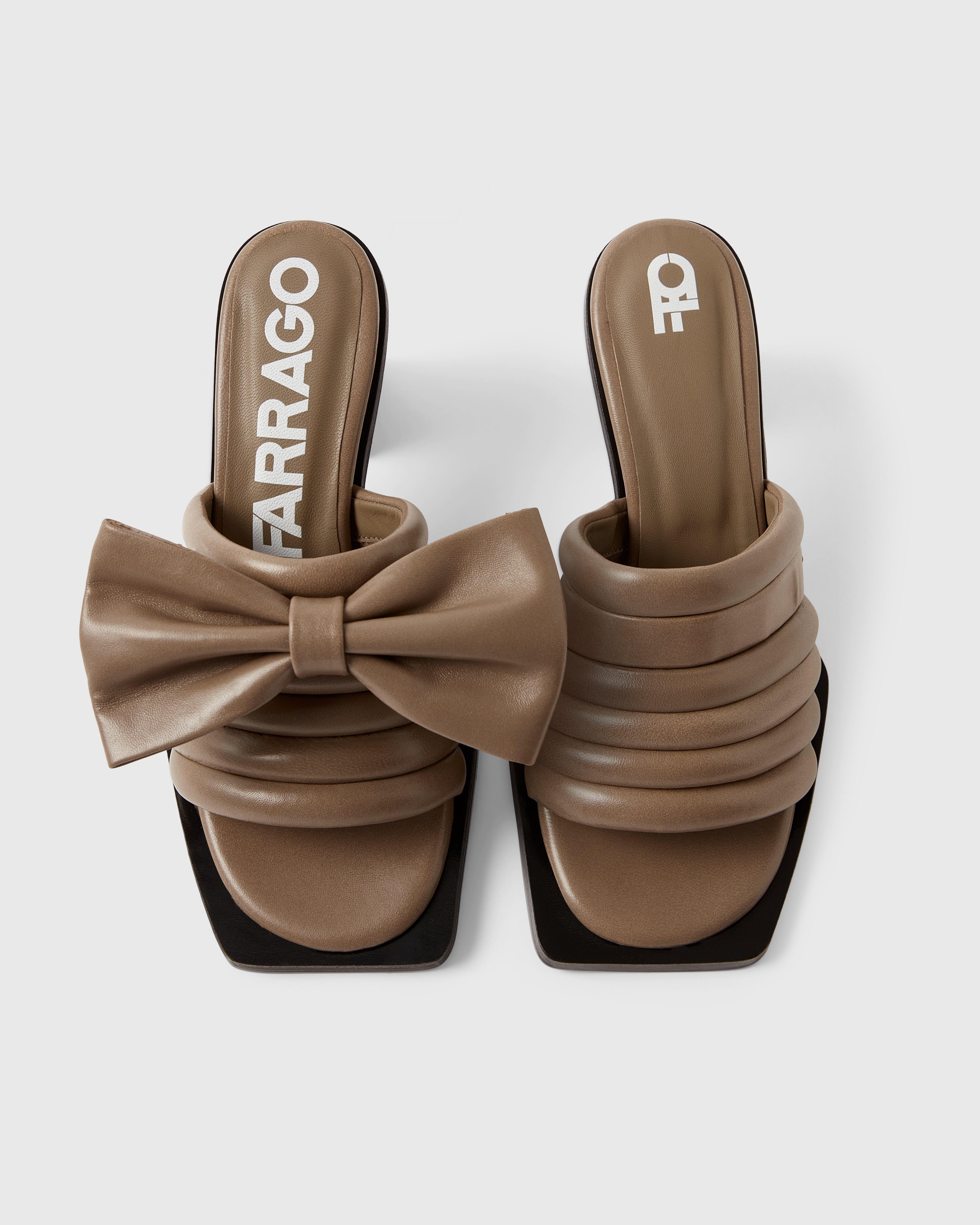 Farrago Charter sustainable designer leather heeled mules in truffle taupe with truffle taupe leather bow accessories.